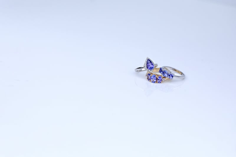 two silver and one gold tanzanite ring 