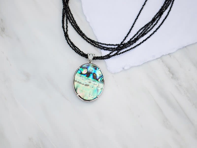 abalone shell, turquoise and topaz enhancer with a black spinel rhodium necklace 