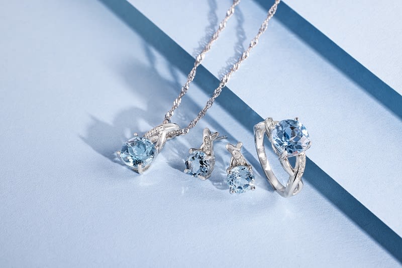 a blue gemstone and silver jewelry set 