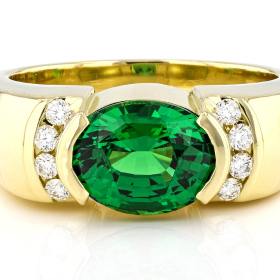green gemstone custom ring set in a yellow gold band