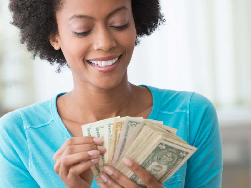 woman holding money 