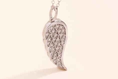 angel wing pendant with diamonds in white gold