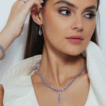 woman wearing tanzanite jewelry