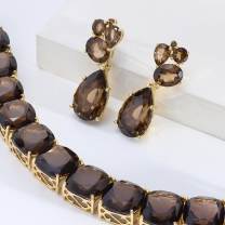 smokey quartz bracelet and earrings with yellow gold settings