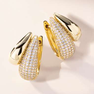 gold earrings with white gemstones 