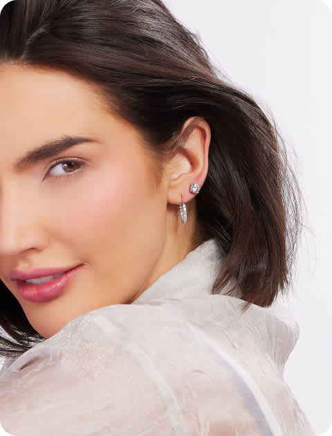 woman wearing multiple earrings 