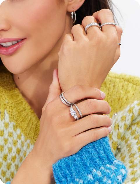 woman wearing stacks of rings