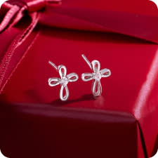 children's silver cross earring with white center stone