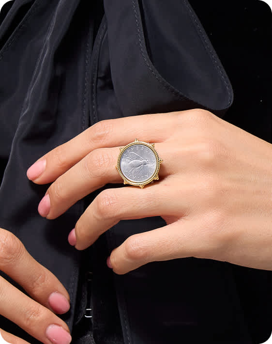 woman wearing coin ring