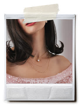woman wearing a moissanite pendant