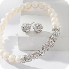 pearl bracelet and stud earrings