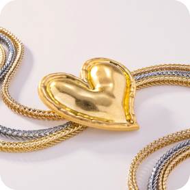 yellow and silver chain necklace with yellow gold heart