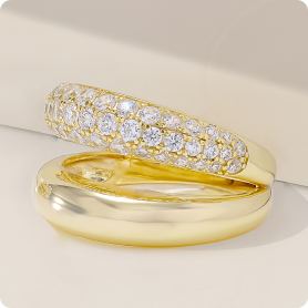 yellow gold band ring with white stones