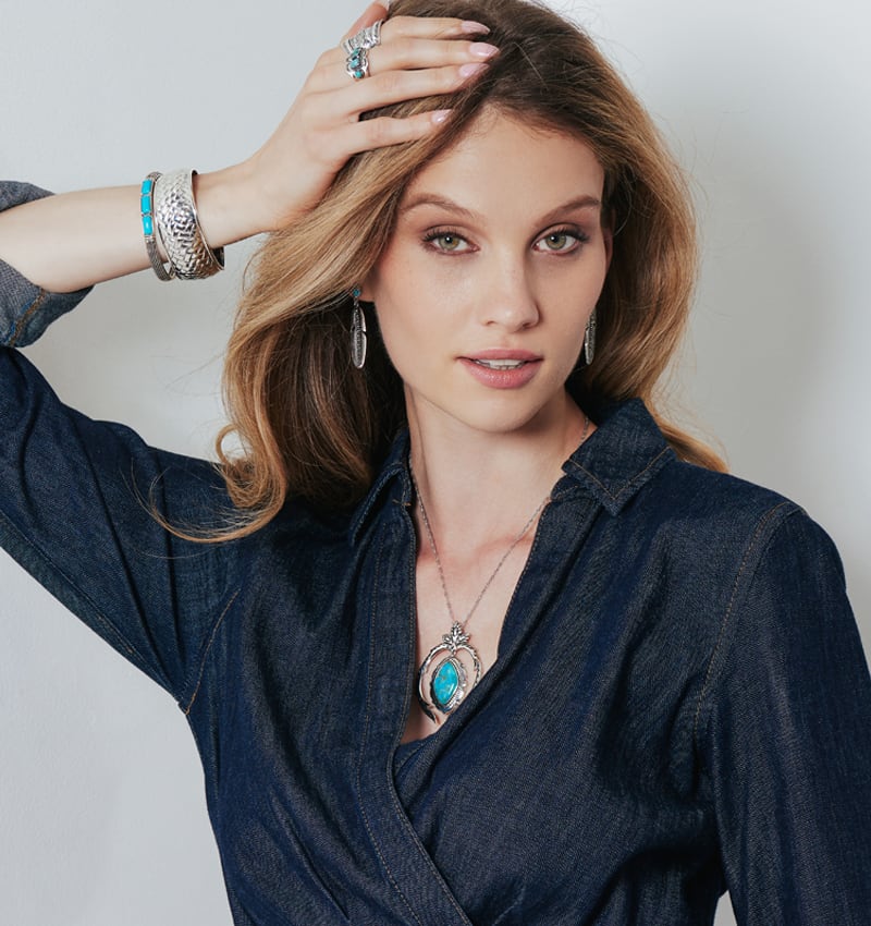 woman wearing southwest jewelry and turquoise earring 