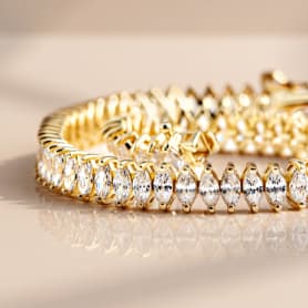 white stone tennis bracelet in yellow gold