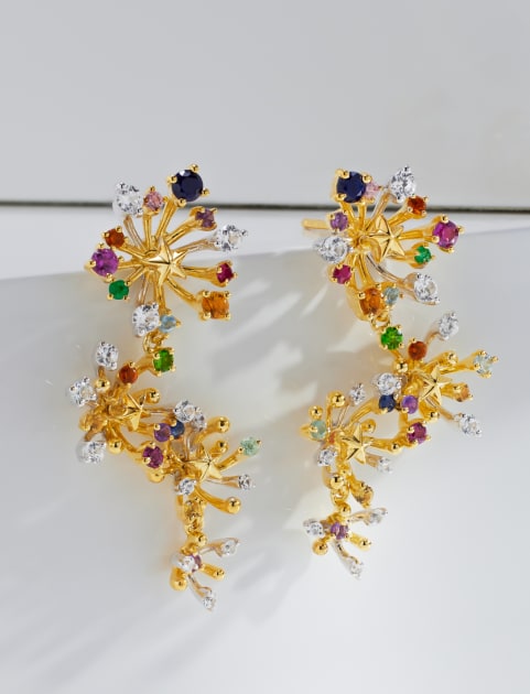woman wearing multiple earrings 