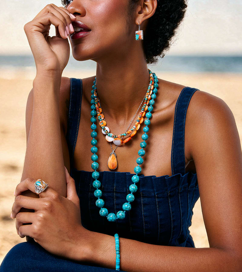 woman wearing layered necklaces 