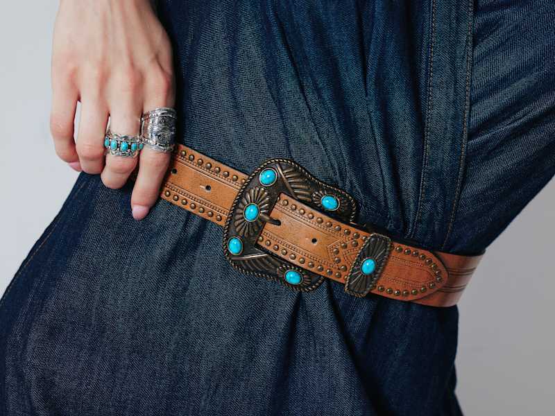 turquoise belt buckle and silver rings 