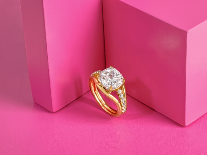 a white gemstone, cushion pave gold ring 