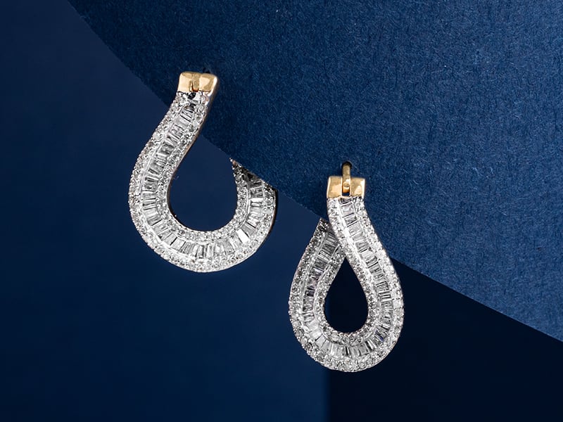 a pair of diamond gold earrings 