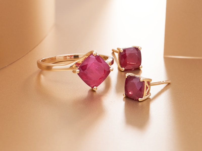 a gold, ruby ring and stud earrings 