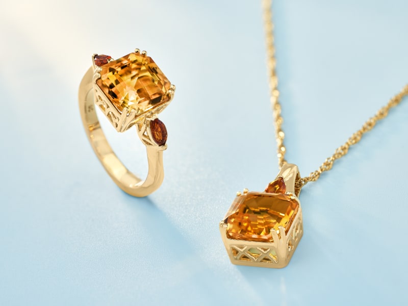a gold, citrine ring and pendant necklace 