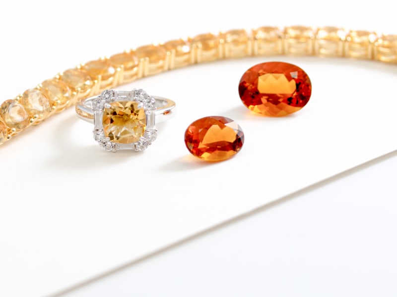 faceted citrine and topaz gemstones with jewelry 
