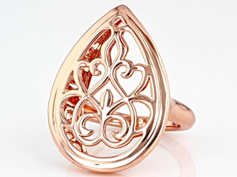 A pear-shaped copper filigree ring 