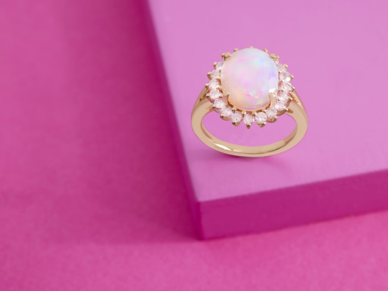 A gold opal halo ring 