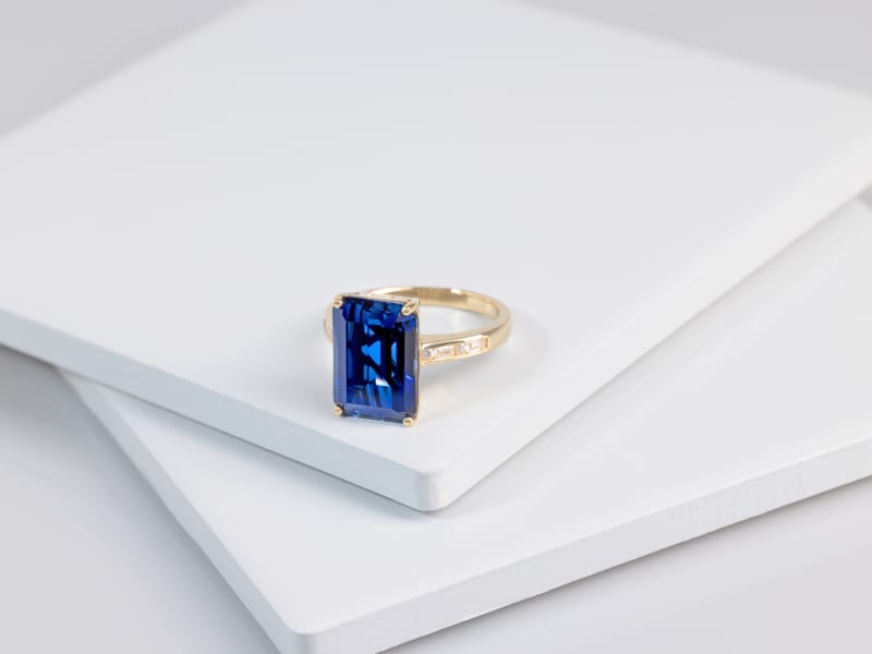 Blue lab created sapphire ring set in yellow gold 