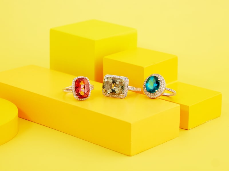 Three gold plated statement rings in different gemstone colors 