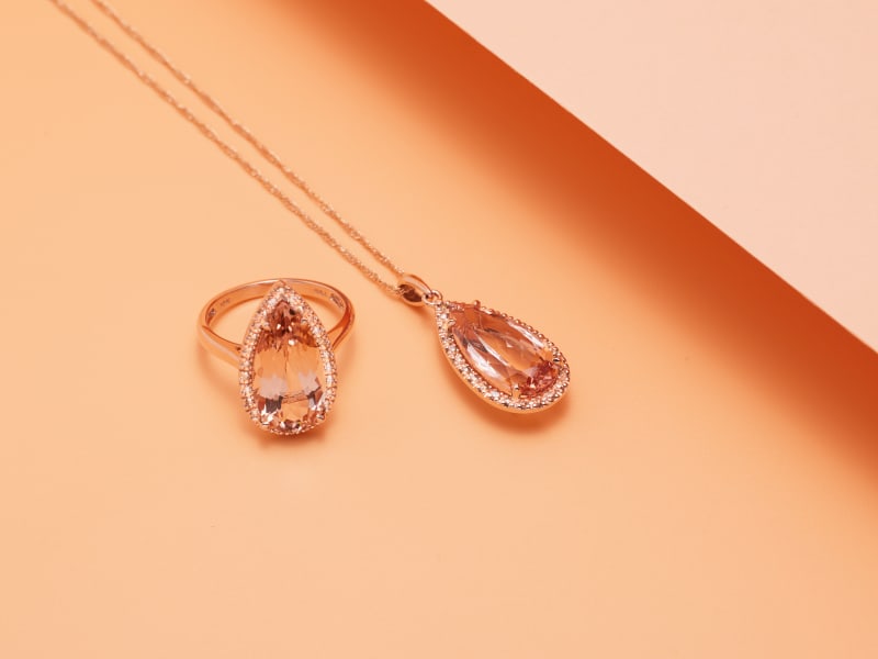 A matching pear-shaped peach morganite ring and pendant 