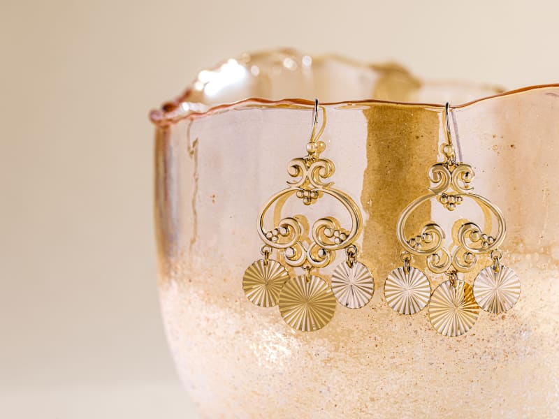 A pair of gold statement dangle earrings 
