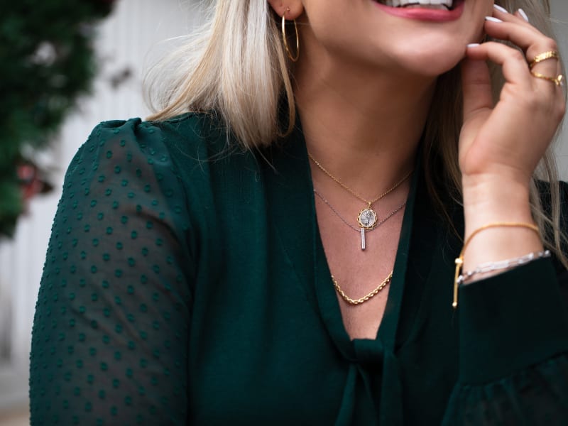 Woman wearing mixed metal jewelry 