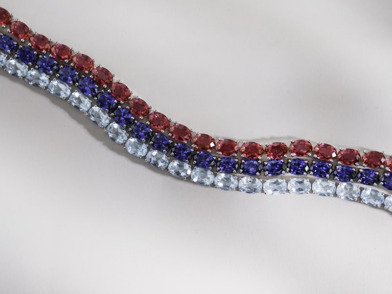 A trio of birthstone tennis bracelets- aquamarine, sapphire and ruby 
