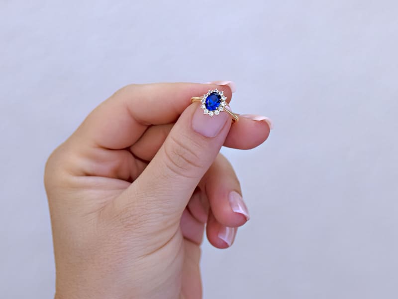 A gold sapphire halo ring 