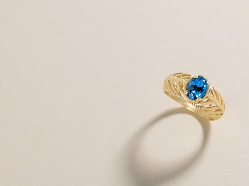 A gold and blue topaz ring 
