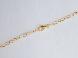 a gold chain necklace with a lobster claw clasp 