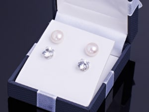 Beautiful white gemstone and pearl stud earrings in a gift box. 