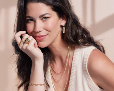 woman wearing gold jewelry 