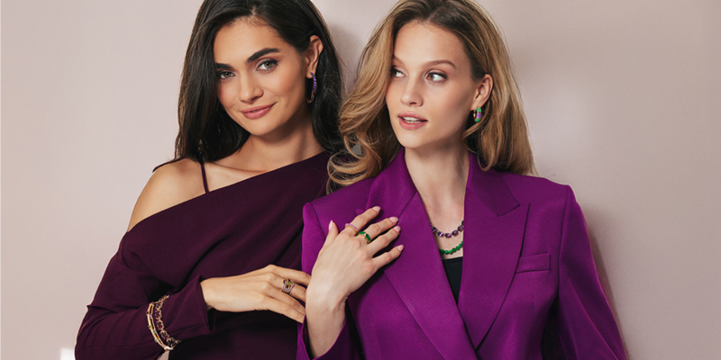 two women wearing custom jewelry 